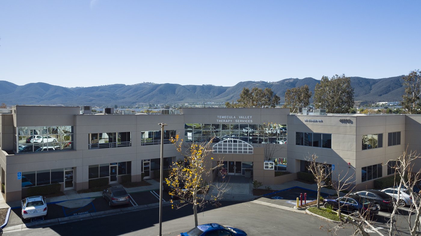 Close exterior view of Enterprise Court office building entrance